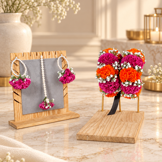 Complete Rang-e-Gul bridal floral jewellery set featuring magenta and orange blooms, white floral fillers, pearl earrings, tikka and matching gajras.