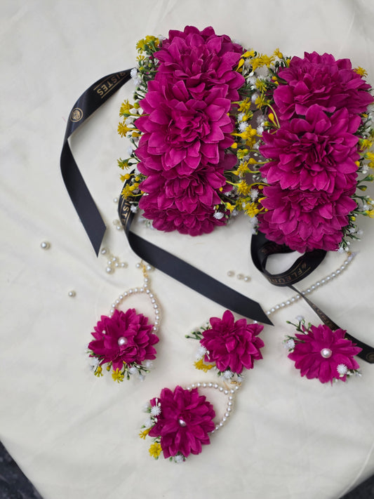 Close-up shot of the vivid hot pink artificial flowers and delicate preserved dried textures on the Hot Pink Bliss jewelry set.