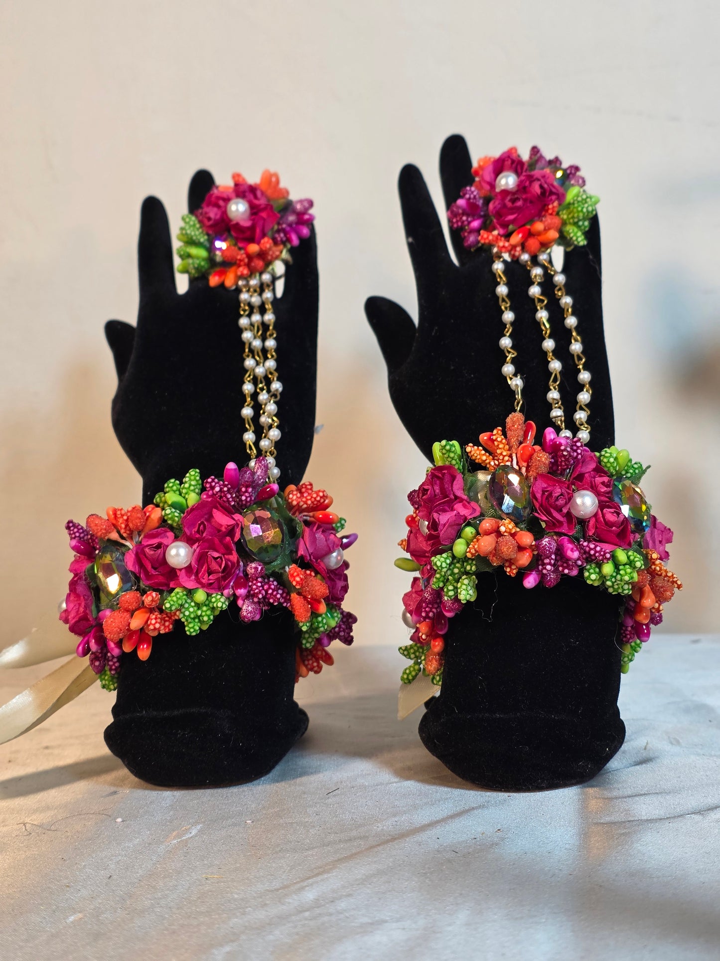 A detailed close-up shot showing the full matching collection of vivid artificial focal flowers and preserved dried textures on the Colour Bloom set.