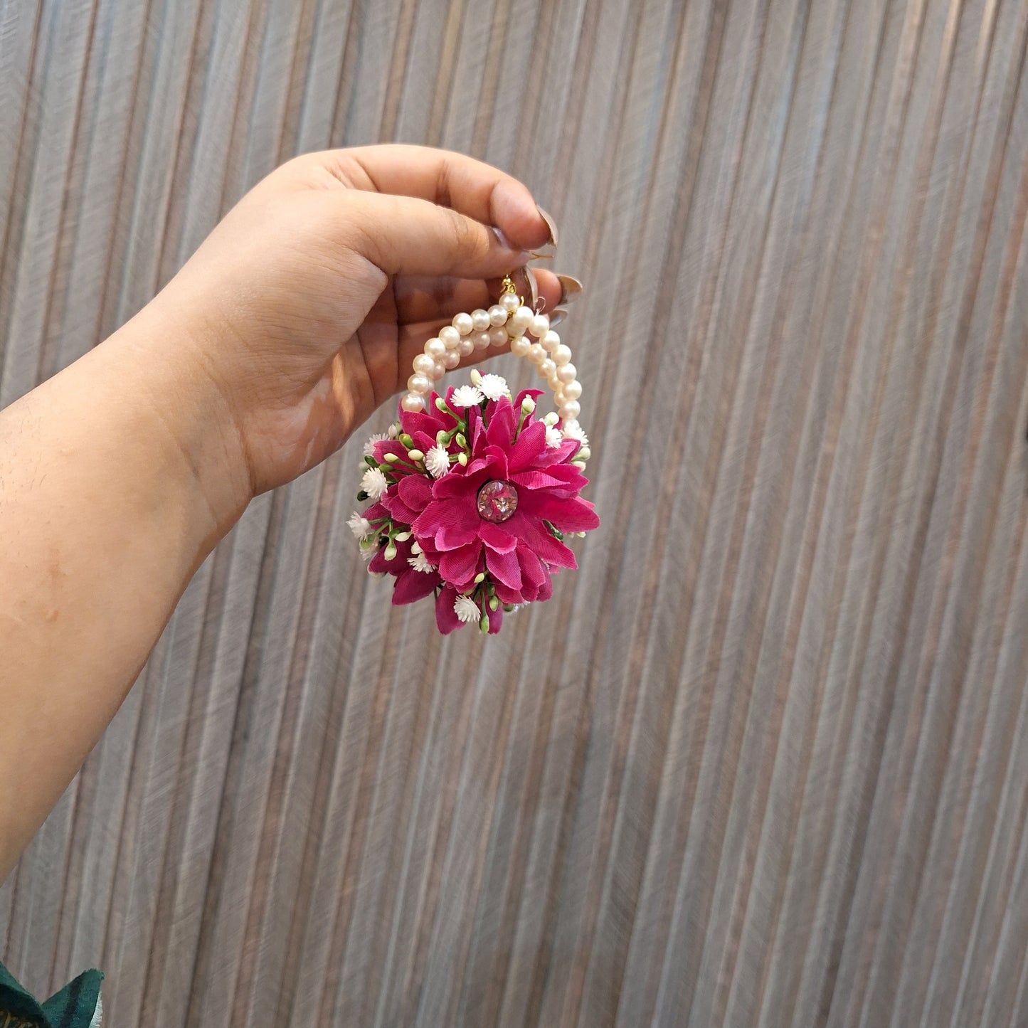 Grace Bloom earrings displayed with the bindi
