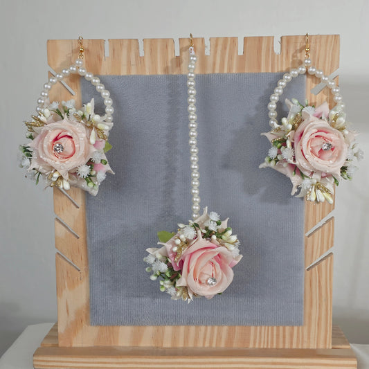 Peach-pink florals with pearl accents and gold-tone detail