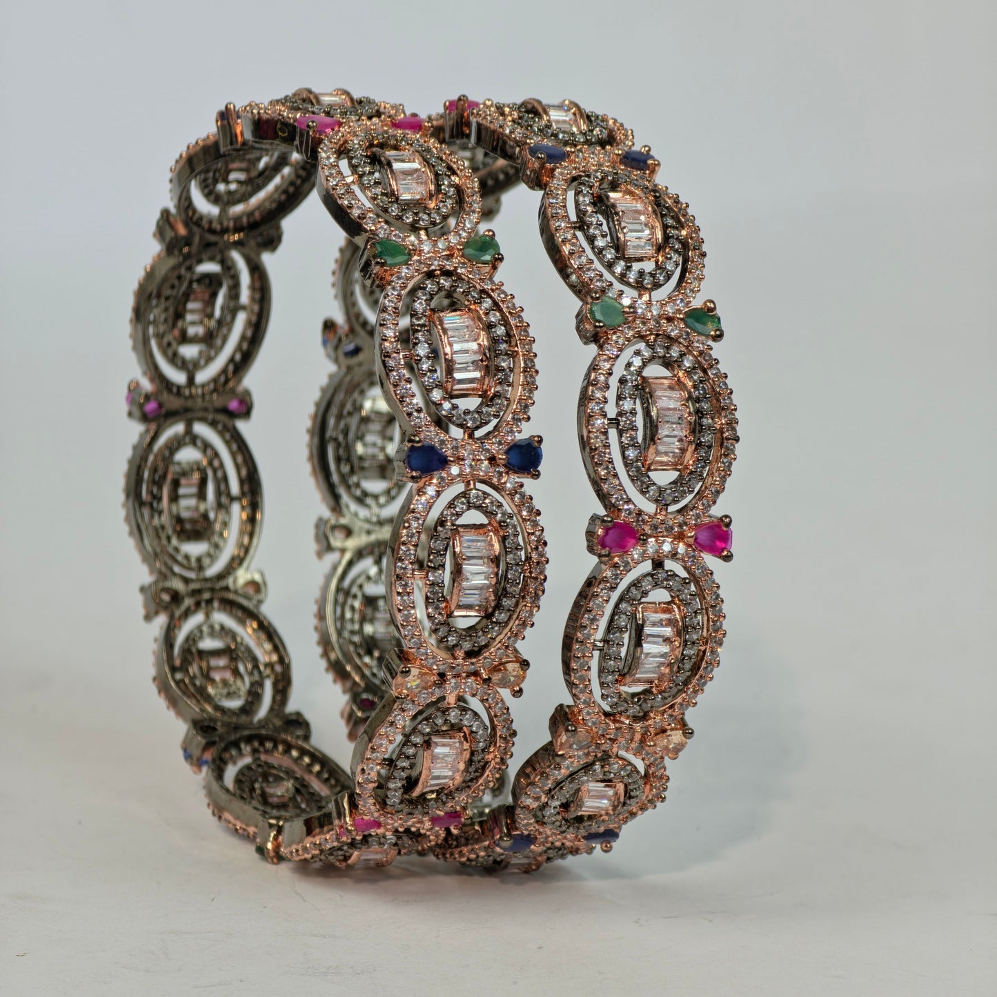 Decorative bracelet with gemstones on a light gray background