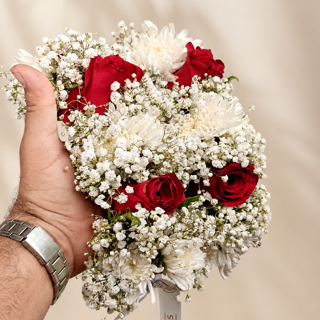 Handcrafted red and white fresh floral gajras featuring premium roses, chrysanthemums and delicate baby’s breath.