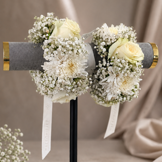 All-white fresh floral gajra pair designed with premium white roses, chrysanthemums and delicate baby’s breath for Nikah