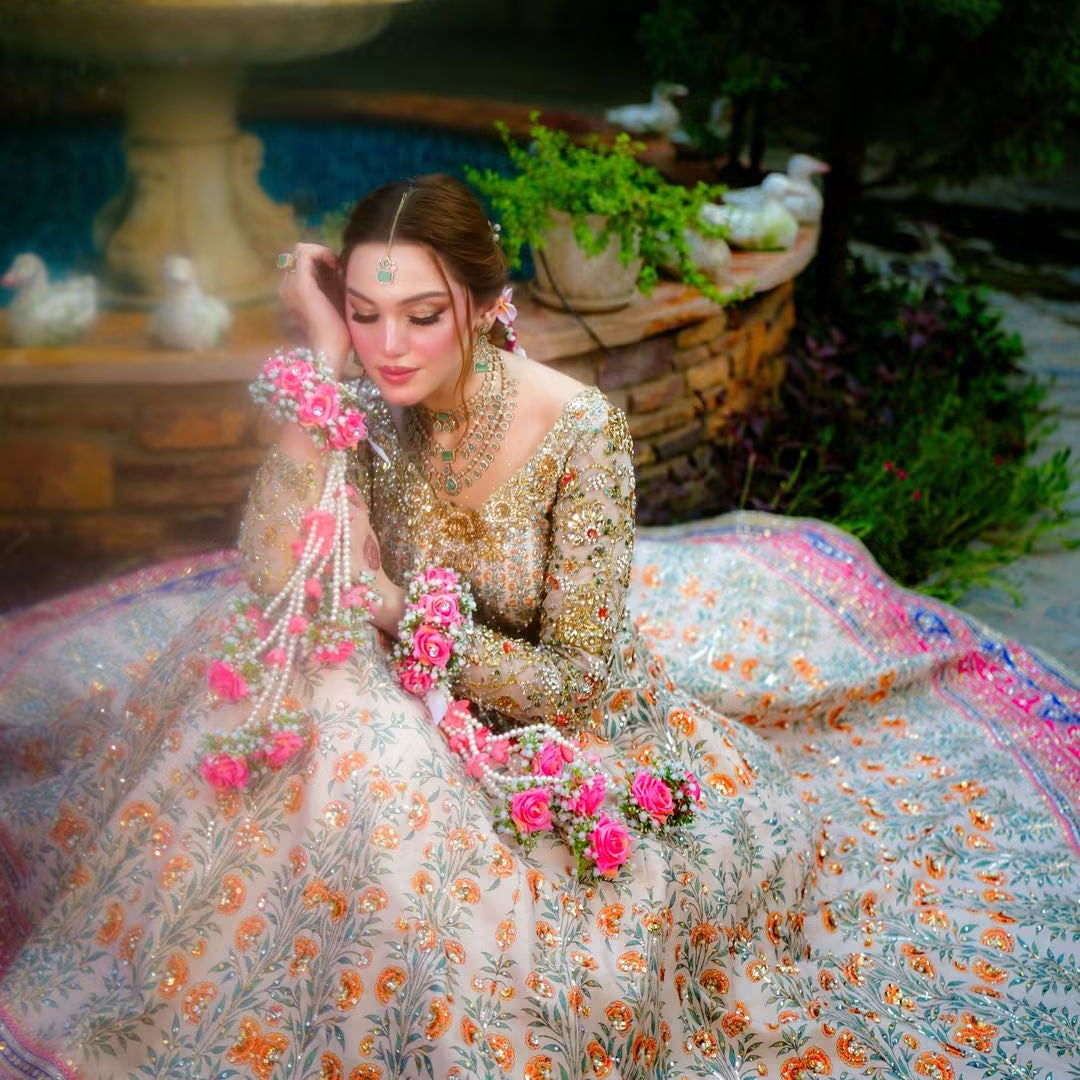 Kaleera-inspired floral gajra pair with extended pearl strands, pink flower accents and detailed floral clusters, designed to add movement and colour to a Mayon or Mehndi bridal look.