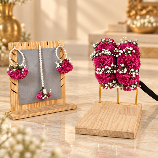 Complete Gulnaar floral jewellery set featuring rich magenta flowers, white fillers, pearl earrings, matching tikka and coordinated bridal gajras.