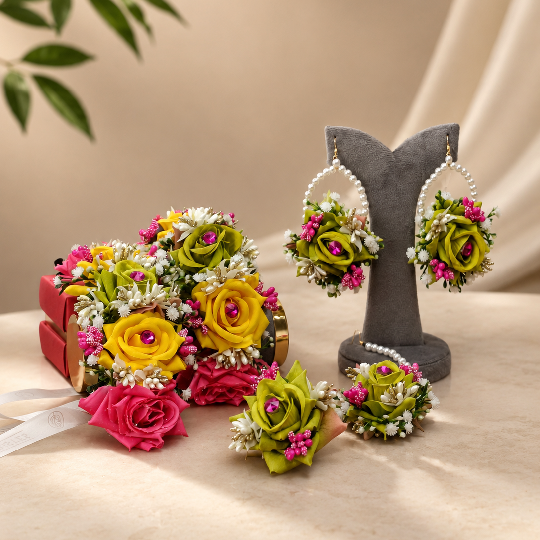 Handcrafted Mehndi bridal jewellery set by De Fleuristes with green, yellow and pink floral accessories, statement pearl earrings and matching bouquet.
