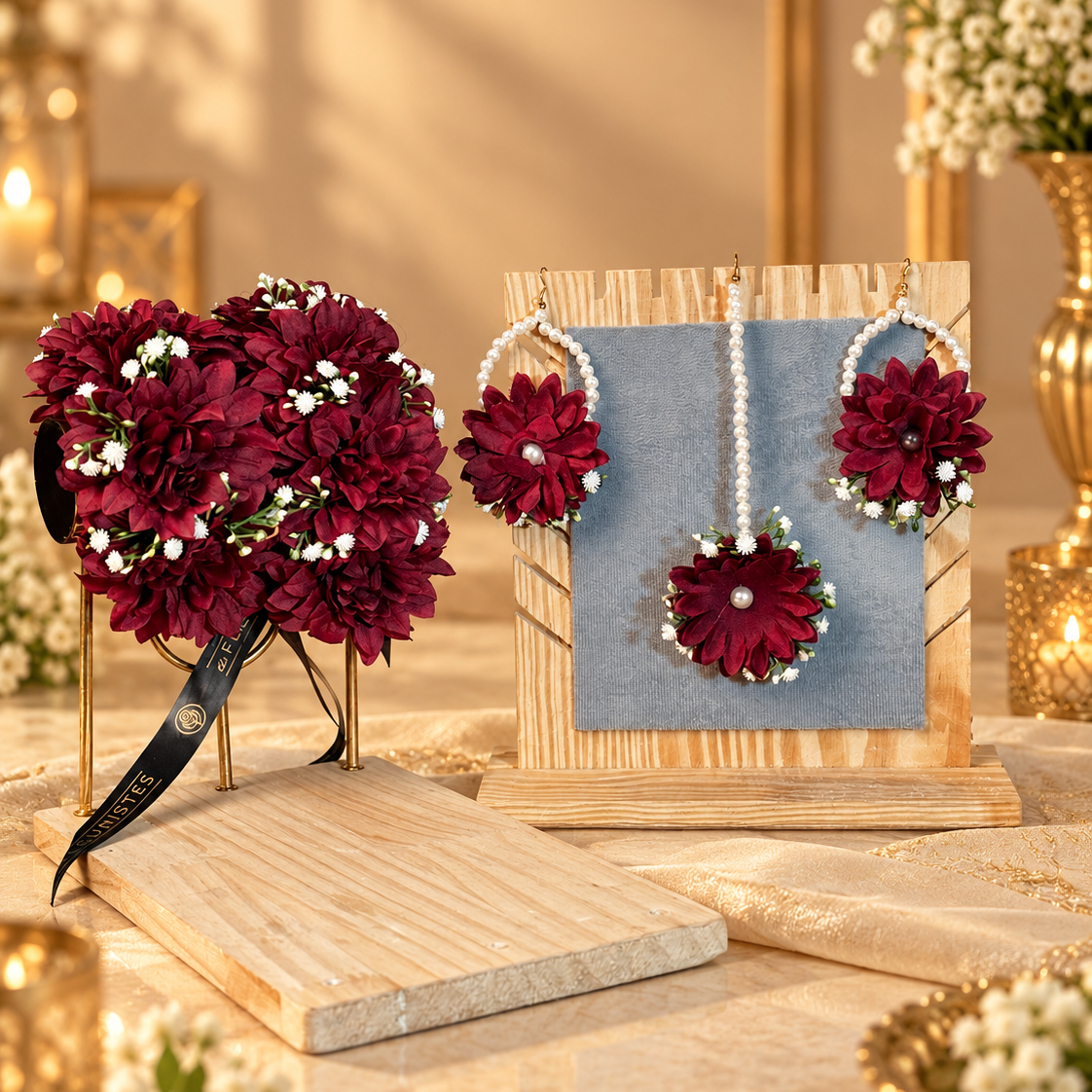 Complete maroon bridal floral jewellery set featuring rich artificial flower gajras, pearl-loop earrings, matching tikka and delicate white floral accents for Pakistani wedding and Nikkah celebrations.