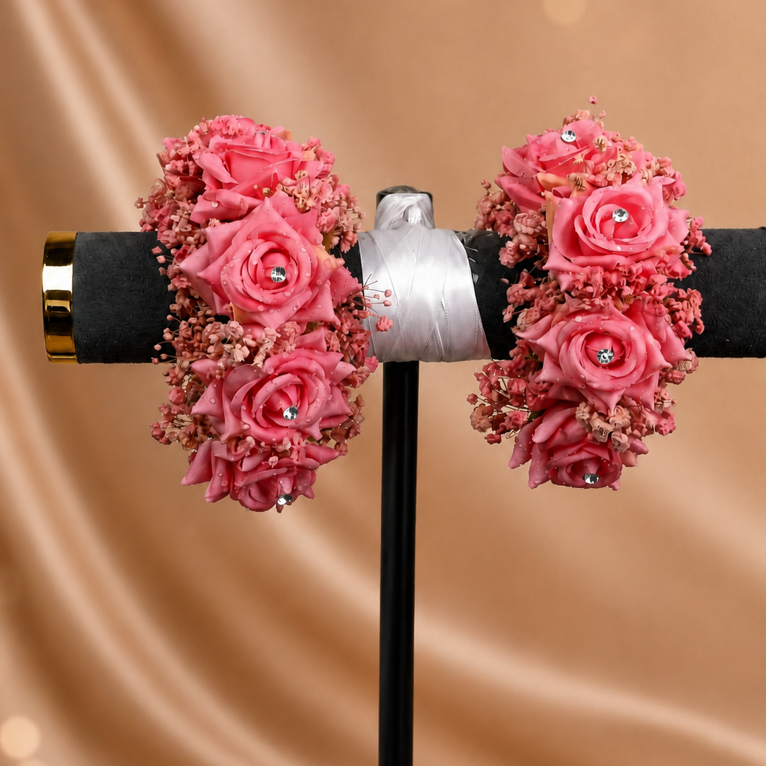 Elegant pink hand gajras featuring layered silk roses, dried baby’s breath and sparkling stone details by De Fleuristes.