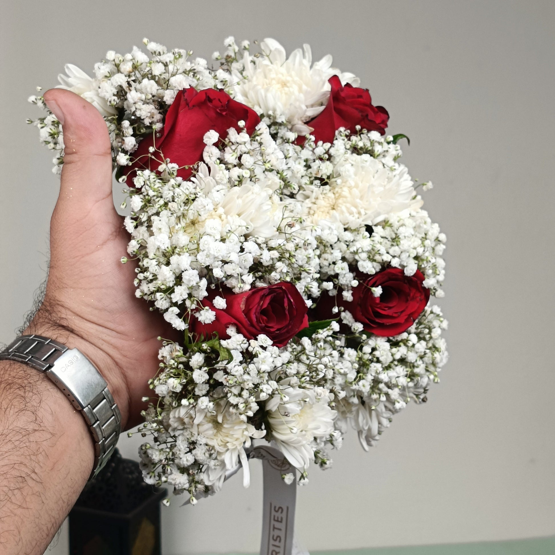 Fresh bridal gajra pair handcrafted with imported red roses, white chrysanthemums and baby’s breath by De Fleuristes.