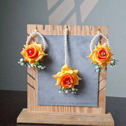 Orange and yellow Sunset Bloom bridal floral jewellery set with floral earrings, tikka and matching hand gajra by De Fleuristes.