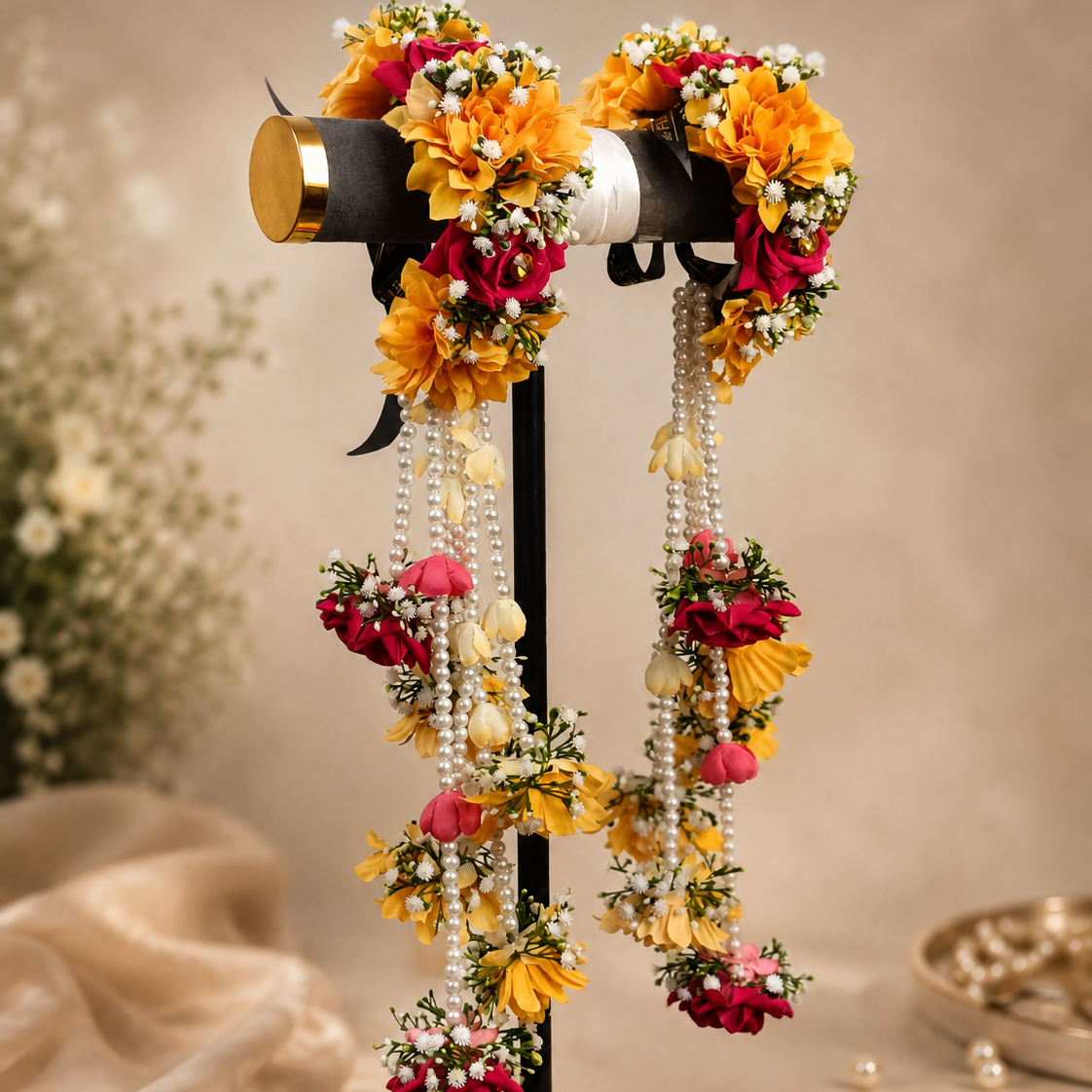 De Fleuristes long bridal floral kaleera pair in yellow and fuchsia pink with cascading white pearl strands and delicate white floral detailing.