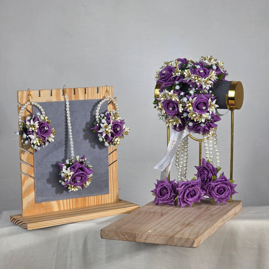 Set of purple flower k artificial kaleera gajra pair worn by a mehndi bride.