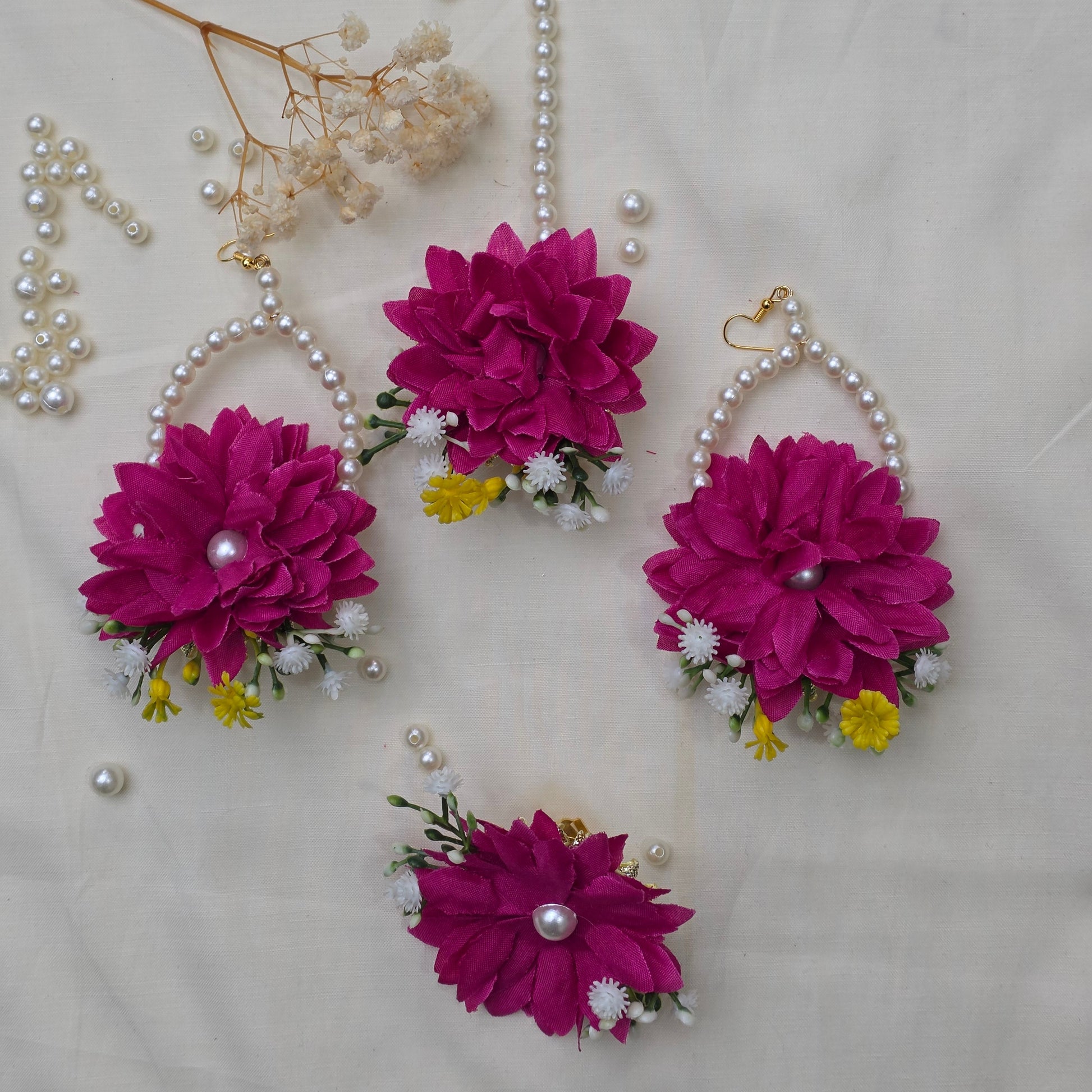A bride wearing the Hot Pink Bliss floral jewelry set for a festive Mehndi celebration in Pakistan.