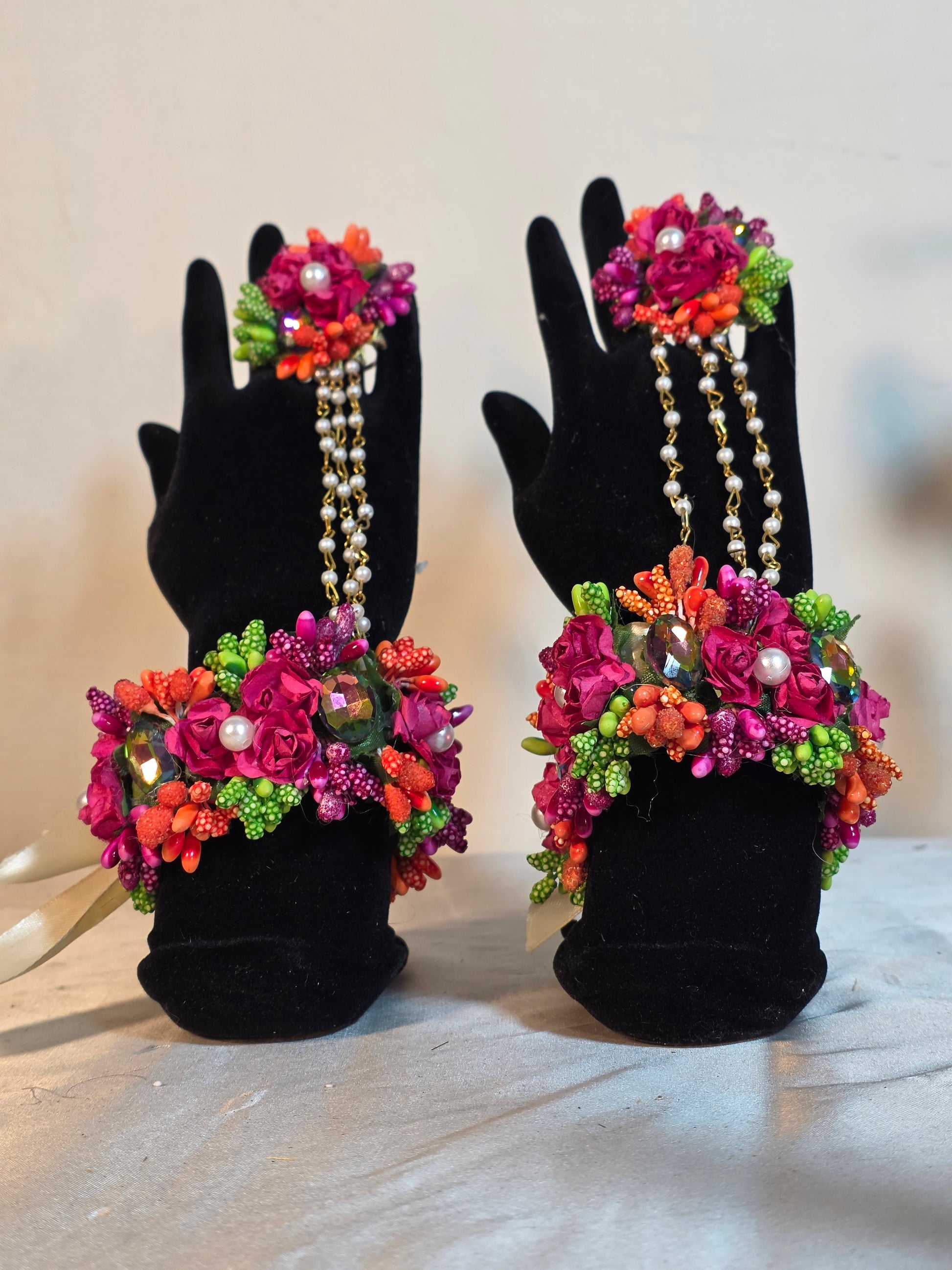 A detailed close-up shot showing the full matching collection of vivid artificial focal flowers and preserved dried textures on the Colour Bloom set.