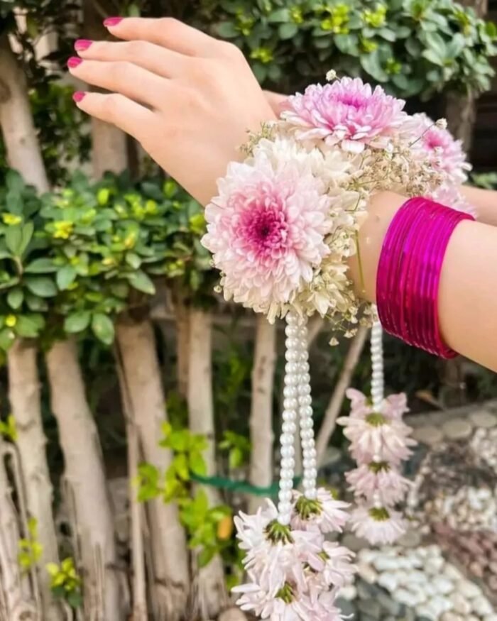 Purple and white gajra set a stunning accessory crafted with imported chrysanthemum flowers.